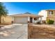 One-story home with gray garage door and landscaping at 1749 W Desert Mountain Dr, San Tan Valley, AZ 85144