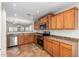 Spacious kitchen with stainless steel appliances and oak cabinets at 1749 W Desert Mountain Dr, San Tan Valley, AZ 85144