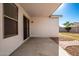 Covered patio with brick pavers and gravel landscaping at 1749 W Desert Mountain Dr, San Tan Valley, AZ 85144