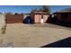 Spacious backyard with a shed, gate, and concrete area at 17862 N 31St Ave, Phoenix, AZ 85053