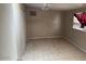 Bedroom with tiled floors, window, and sliding glass door at 17862 N 31St Ave, Phoenix, AZ 85053