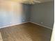 Empty bedroom featuring new wood floors and walls painted with a blue tone. Ready for personalization at 17862 N 31St Ave, Phoenix, AZ 85053