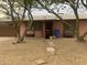 Pink single story home with a gravel yard and two large trees at 17862 N 31St Ave, Phoenix, AZ 85053