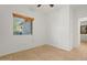 Bright bedroom with tile floors and window at 19234 W Woodlands Ave, Buckeye, AZ 85326