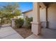 Front porch with columns and walkway leading to gate at 19234 W Woodlands Ave, Buckeye, AZ 85326