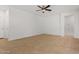 Bright and airy living room with tile flooring at 19234 W Woodlands Ave, Buckeye, AZ 85326