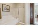 Bathroom with soaking tub, shower, and linen closet at 19550 N Grayhawk Dr # 1136, Scottsdale, AZ 85255