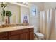 Guest bathroom with single vanity and shower/tub combo at 19550 N Grayhawk Dr # 1136, Scottsdale, AZ 85255