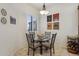 Charming breakfast nook with glass table and four chairs at 19550 N Grayhawk Dr # 1136, Scottsdale, AZ 85255