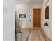 Elegant entryway with tile flooring and decorative wall art at 19550 N Grayhawk Dr # 1136, Scottsdale, AZ 85255