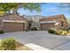 Two-car garage with stone and stucco exterior at 19550 N Grayhawk Dr # 1136, Scottsdale, AZ 85255