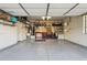 Garage with overhead storage and workbench at 19550 N Grayhawk Dr # 1136, Scottsdale, AZ 85255