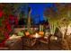 Charming backyard patio featuring a fire pit and desert landscaping at 19550 N Grayhawk Dr # 1136, Scottsdale, AZ 85255