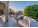 Outdoor kitchen area with built-in grill and seating at 19608 N Regents Park Dr, Surprise, AZ 85387