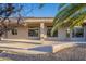 Exterior view of house showcasing architectural details and landscaping at 19608 N Regents Park Dr, Surprise, AZ 85387