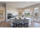 Modern kitchen featuring stainless steel appliances and an expansive island at 19608 N Regents Park Dr, Surprise, AZ 85387