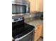 Stainless steel appliances and granite countertops at 2030 N 108Th N Dr, Avondale, AZ 85392