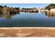 Scenic view of a tranquil lake with lush vegetation at 2030 N 108Th N Dr, Avondale, AZ 85392