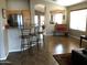 Open floor plan with tile flooring and kitchen bar at 2030 N 108Th N Dr, Avondale, AZ 85392