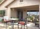 Covered patio with table and chairs, offering a relaxing outdoor space at 2030 N 108Th N Dr, Avondale, AZ 85392