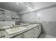 Elegant bathroom with double sinks and marble shower at 20660 N 40Th St # 2140, Phoenix, AZ 85050