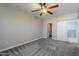 Bedroom with ceiling fan, sliding barn door to bath at 20660 N 40Th St # 2140, Phoenix, AZ 85050