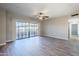 Spacious living room with hardwood floors and sliding glass doors to balcony at 20660 N 40Th St # 2140, Phoenix, AZ 85050