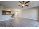 Spacious living room with hardwood floors and ceiling fan at 20660 N 40Th St # 2140, Phoenix, AZ 85050