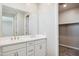 Double vanity bathroom with linen closet at 21047 N 58Th Way, Phoenix, AZ 85054