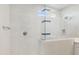 Modern bathroom with marble-tiled shower and glass enclosure at 21047 N 58Th Way, Phoenix, AZ 85054