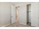 Bright bedroom with double door closet and access to hallway at 21047 N 58Th Way, Phoenix, AZ 85054