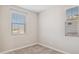 Well-lit bedroom with two windows and neutral wall color at 21047 N 58Th Way, Phoenix, AZ 85054