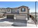 Two-story house with two car garage and landscaped yard at 21047 N 58Th Way, Phoenix, AZ 85054