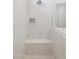 Spa-like shower with built-in seat and marble tile at 21047 N 58Th Way, Phoenix, AZ 85054