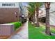 Shopping center walkway lined with palm trees and outdoor seating at 21047 N 58Th Way, Phoenix, AZ 85054