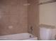 Bathroom with a shower/tub combo and tile surround at 2138 W Beaubien Dr, Phoenix, AZ 85027