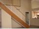 Indoor view of a wooden staircase with a white railing at 2138 W Beaubien Dr, Phoenix, AZ 85027