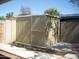 Tan corrugated metal storage shed in backyard at 2138 W Beaubien Dr, Phoenix, AZ 85027