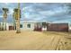 House exterior with desert landscaping and wooden fence at 2191 S Descanso Rd, Apache Junction, AZ 85119