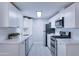 Modern kitchen with white shaker cabinets, quartz counters, and stainless steel appliances at 2191 S Descanso Rd, Apache Junction, AZ 85119