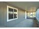 Screened porch with concrete flooring and exterior door at 2191 S Descanso Rd, Apache Junction, AZ 85119