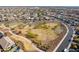 Aerial view of Liberty Park, featuring a playground, basketball court, and surrounding homes at 22413 N 101St Ave, Peoria, AZ 85383