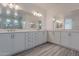 Elegant bathroom with double vanity and large shower at 22413 N 101St Ave, Peoria, AZ 85383