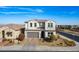 Two-story house with gray garage door and landscaping at 22413 N 101St Ave, Peoria, AZ 85383