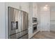 Modern kitchen with white cabinets and stainless steel appliances at 22413 N 101St Ave, Peoria, AZ 85383