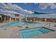 Relaxing pool and spa area with shade structures and lounge chairs at 22413 N 101St Ave, Peoria, AZ 85383