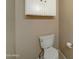 Simple bathroom with toilet and white cabinet at 225 W 1St St # 118, Mesa, AZ 85201