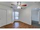 Bright bedroom with ceiling fan and wood flooring at 225 W 1St St # 118, Mesa, AZ 85201