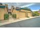 Tan stucco building with a double garage and walkway at 225 W 1St St # 118, Mesa, AZ 85201