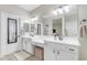 Modern bathroom with double vanity, plenty of counter space and a large mirror at 2346 S Banning St, Gilbert, AZ 85295